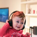 a baby listening on headphones