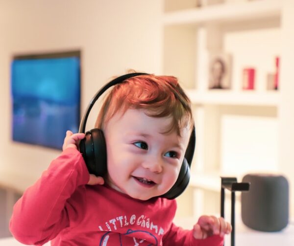 a baby listening on headphones