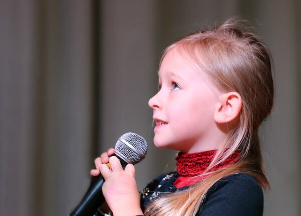 girl holding microphone